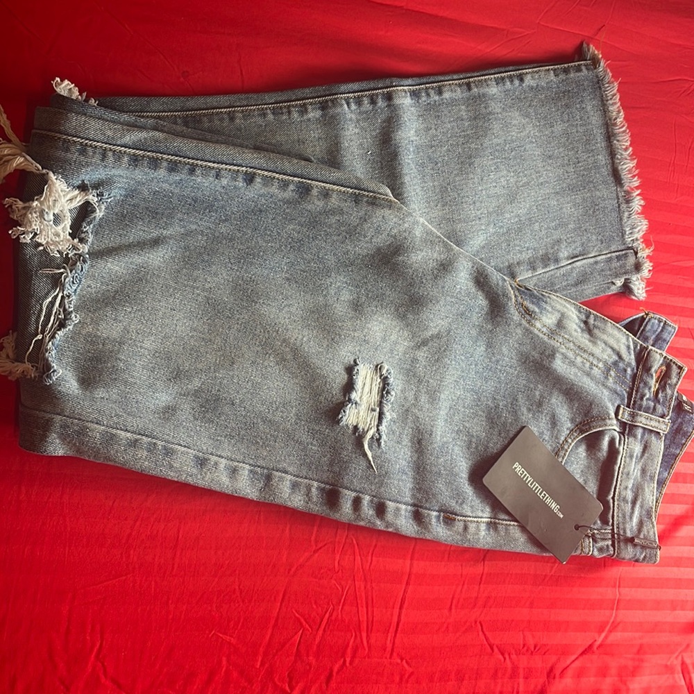 Prettylittlething Mid wash High Rise Distressed Size 4